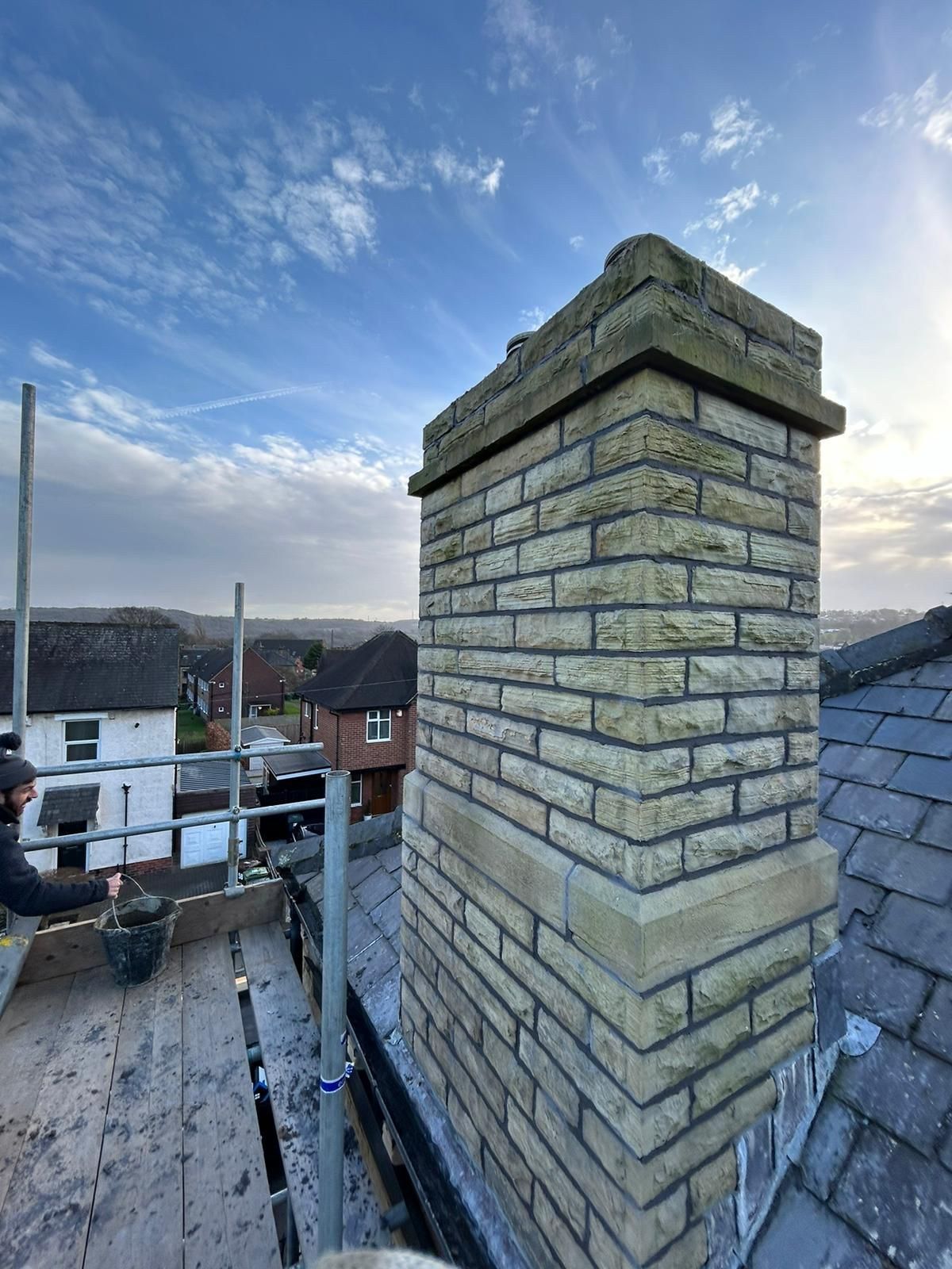 Rebuilt stone chimney stack with new flaunching