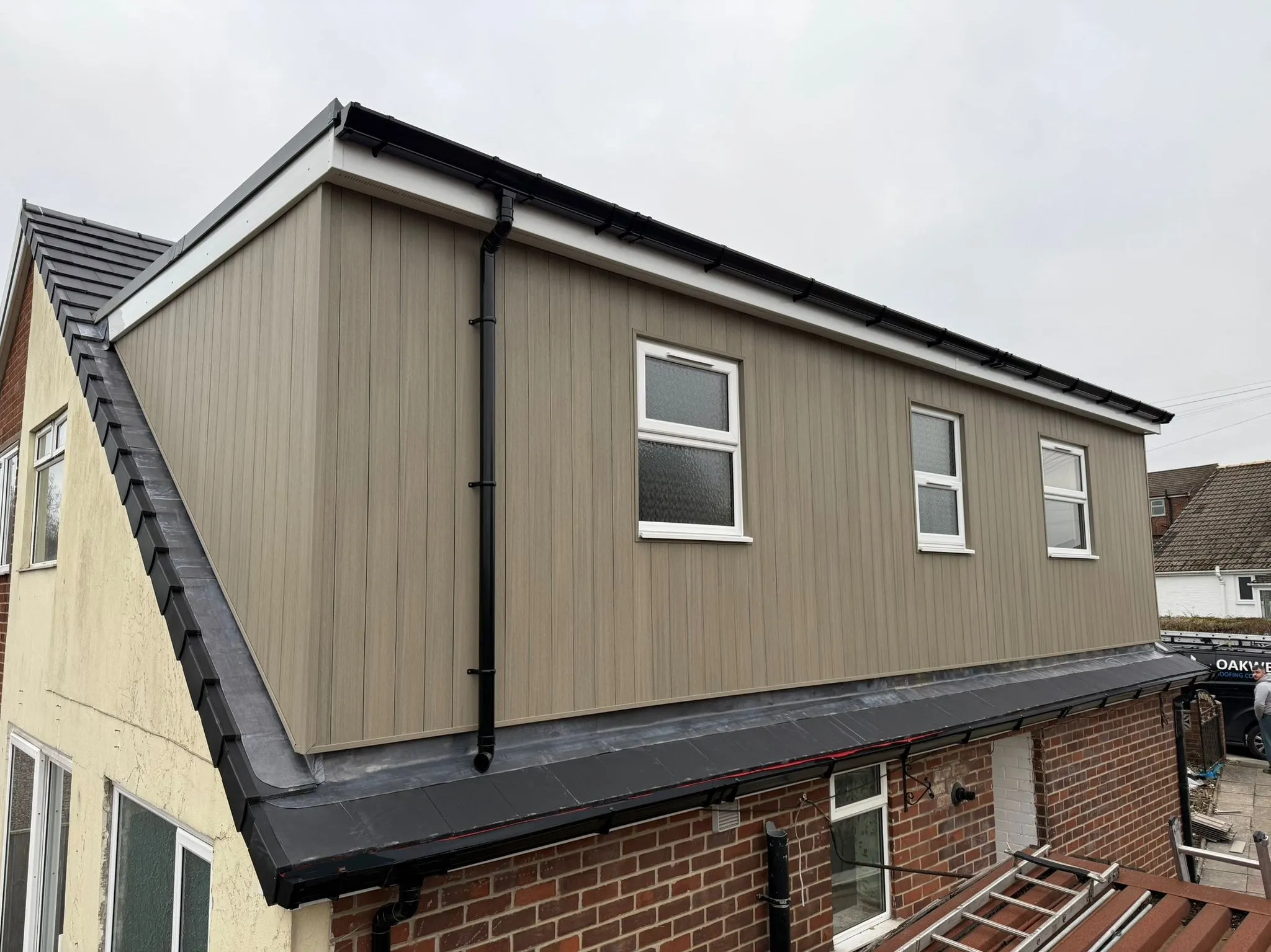 Finished dormer with composite cladding and a tiled main roof