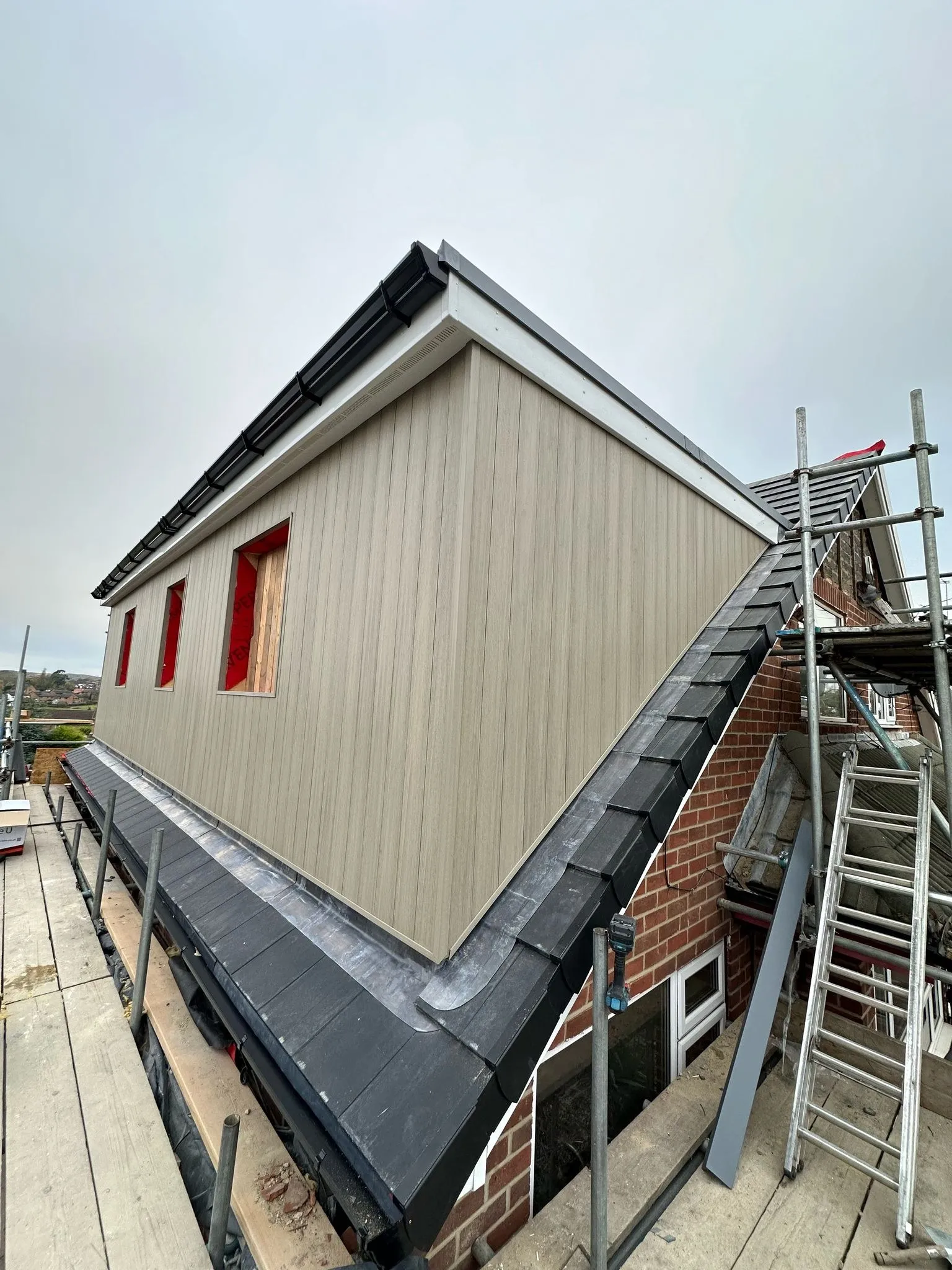 Dormer being clad with scaffolding in place