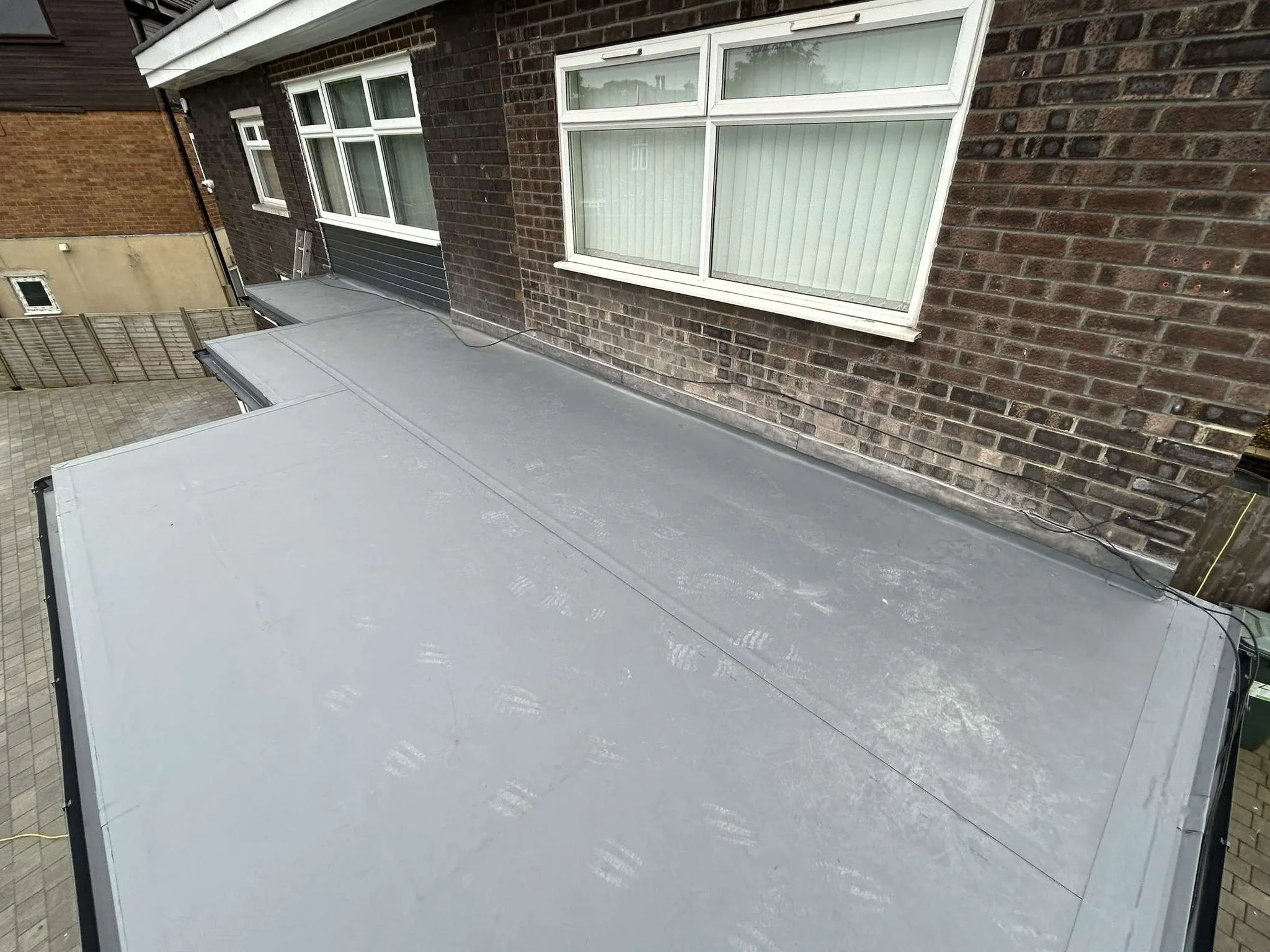 Grey GRP flat roof on a house extension