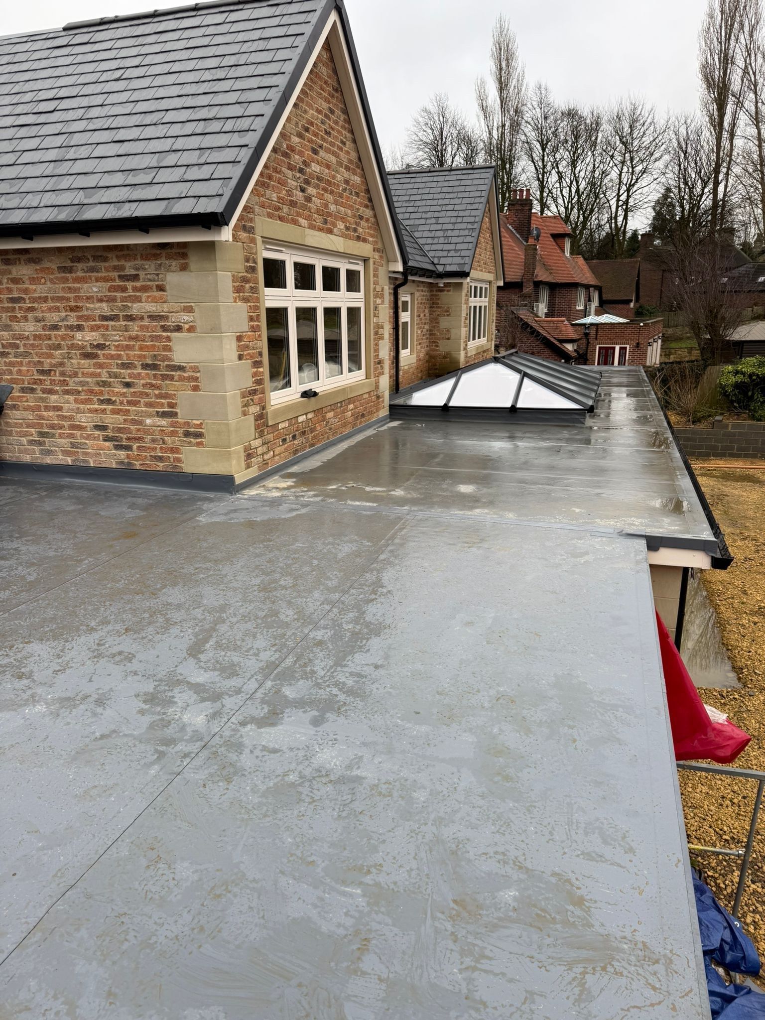 Roof lantern set into a GRP flat roof on a stone extension