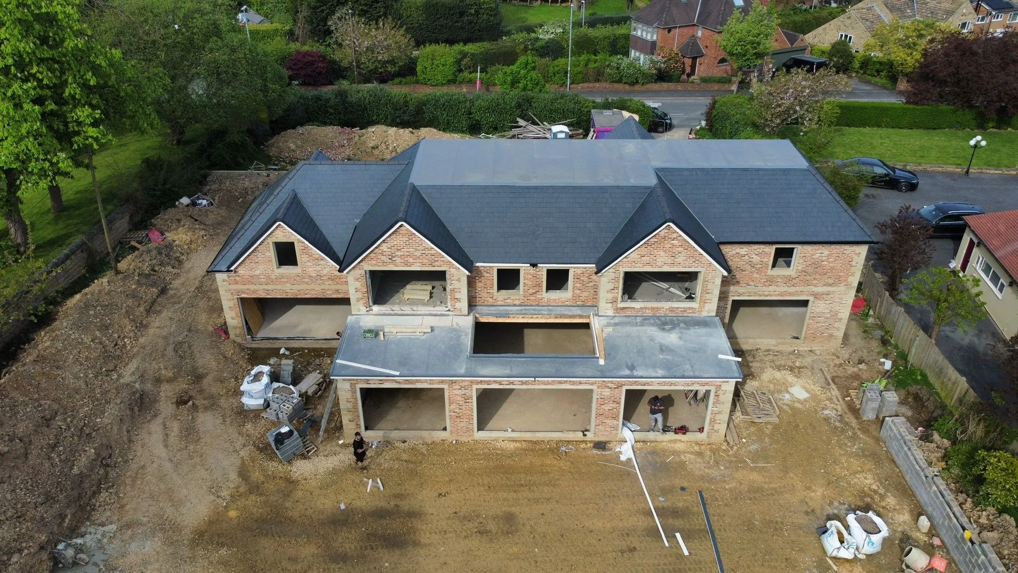 Front elevation of a new build with slate roof, drone view