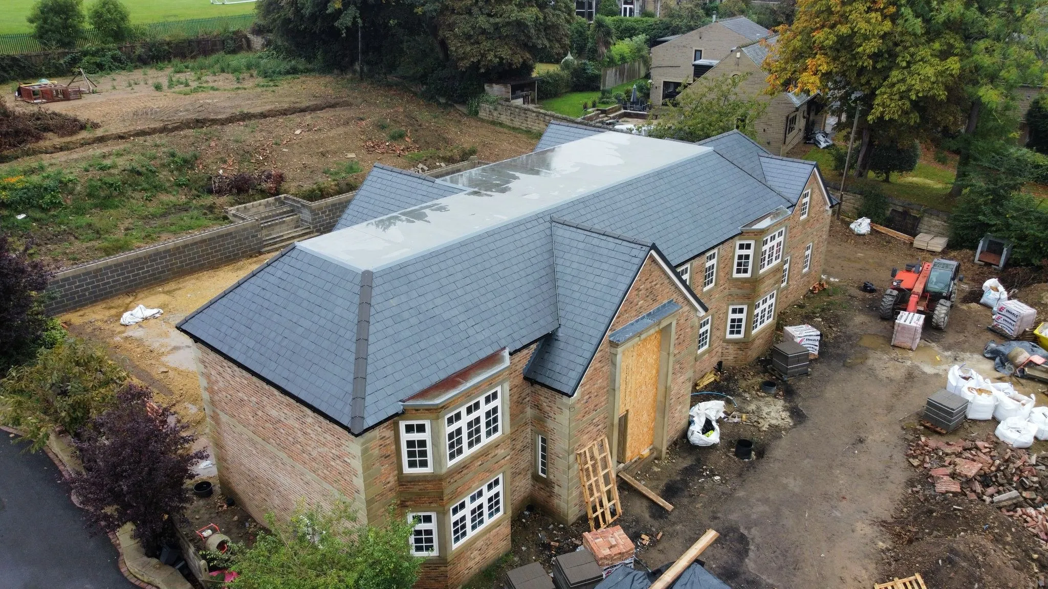 Rear of a new build with slate roof, drone view