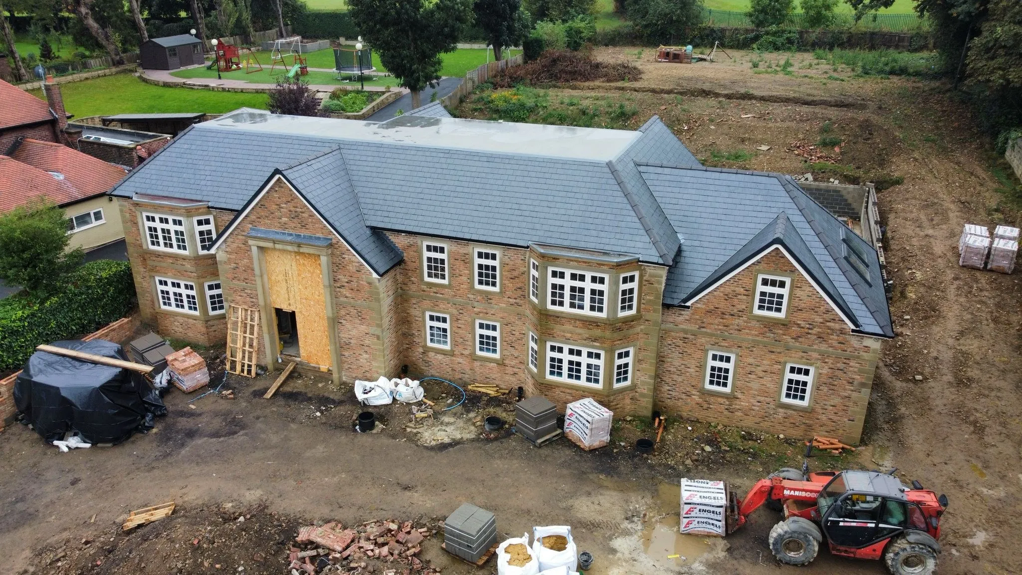 Large stone-built house with a complete slate roof