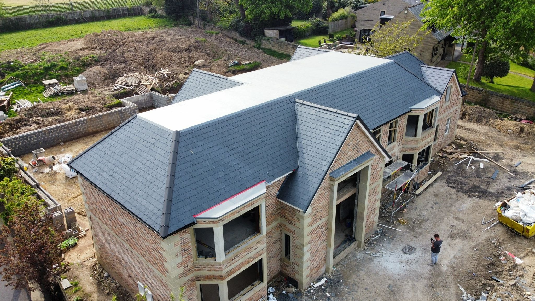 Stone-built new house with a full natural slate roof