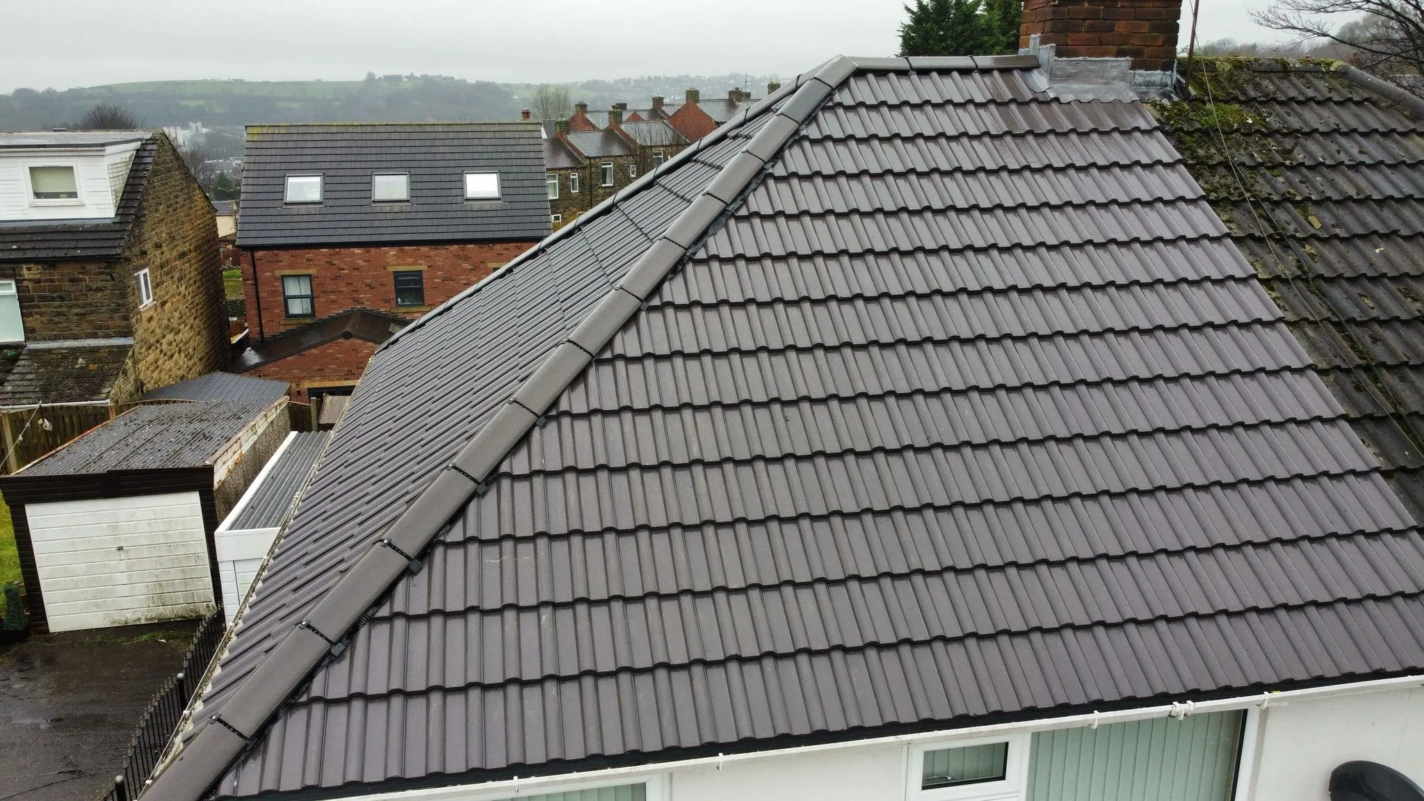 Finished tile roof seen from the scaffold after a re-roof
