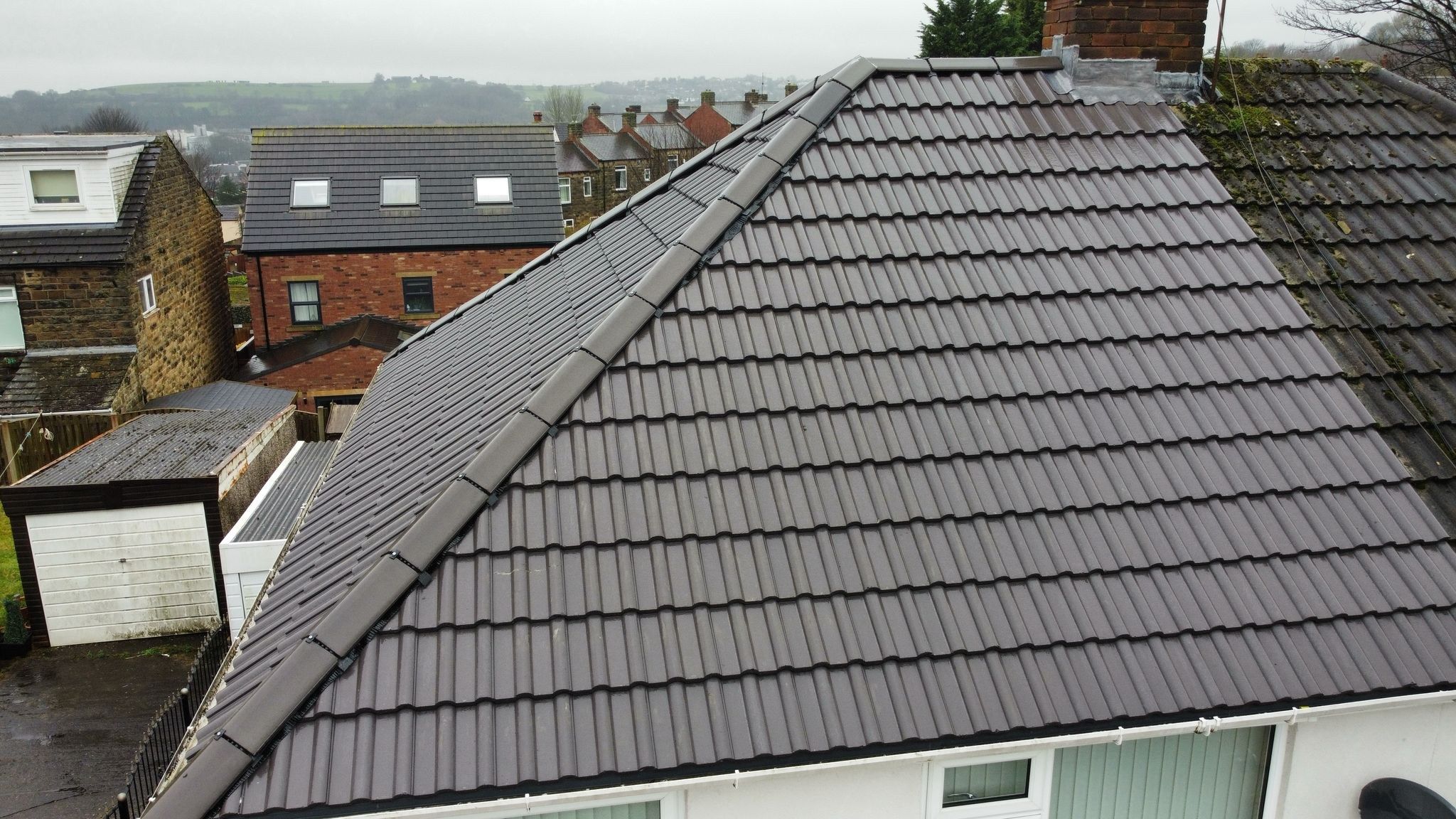 Finished tile roof seen from the scaffold after a re-roof