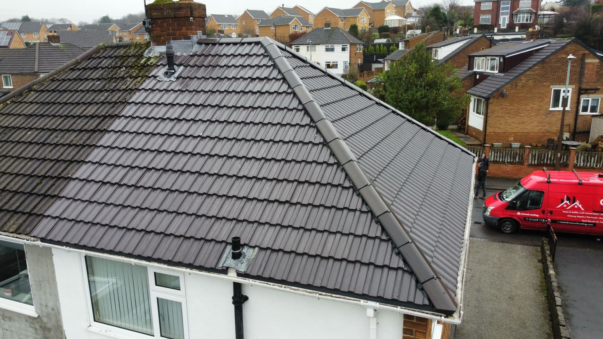 Re-roofed semi-detached house with the Oakwell Roofing van outside